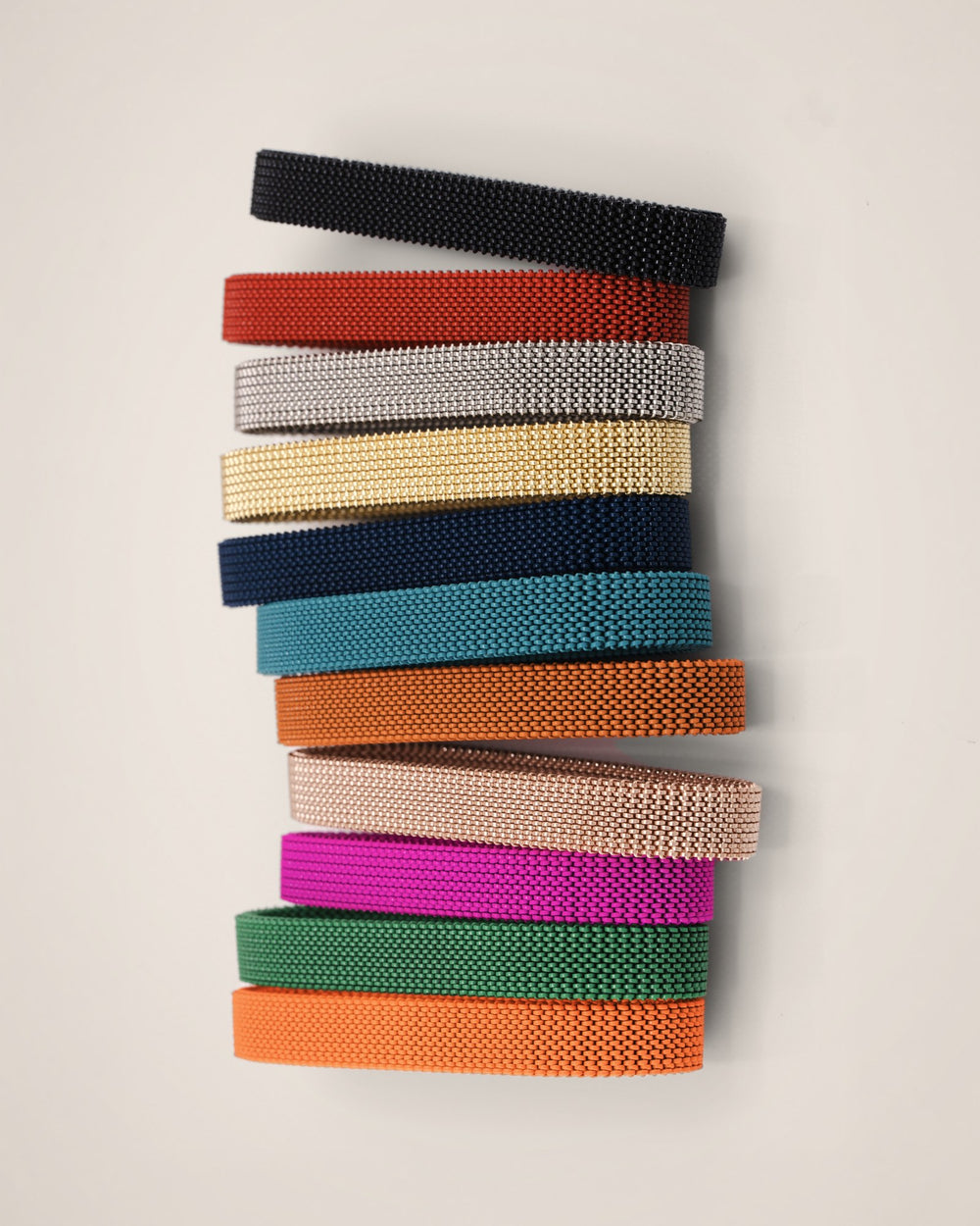 D'ORO woven mesh bands in eleven colors, stacked