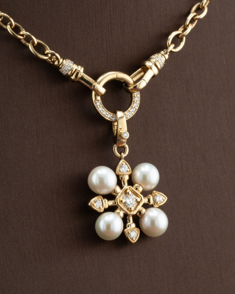 Close-up of the D'ORO pearl and diamond flower pendant