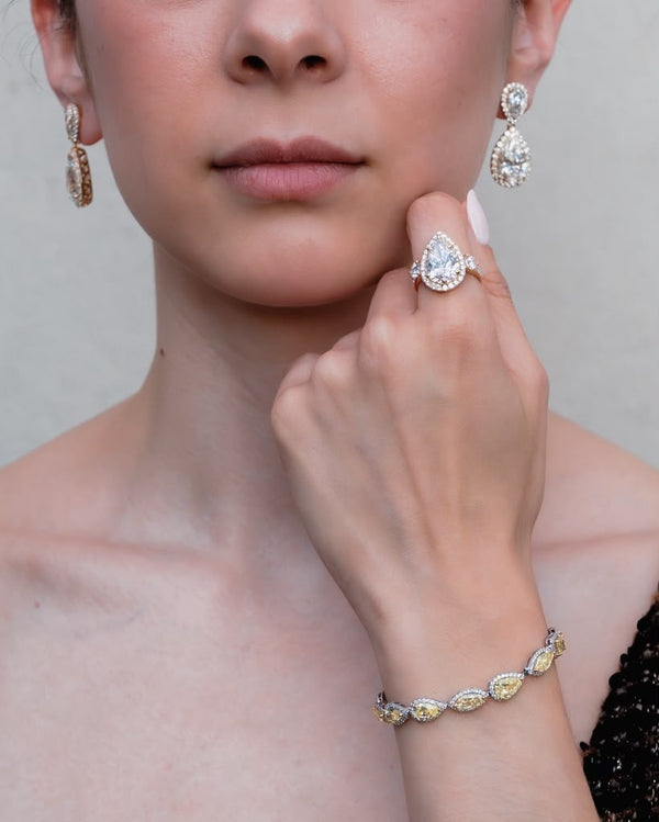 D'ORO Lab lab-grown diamond earrings, pear ring and bracelet worn together