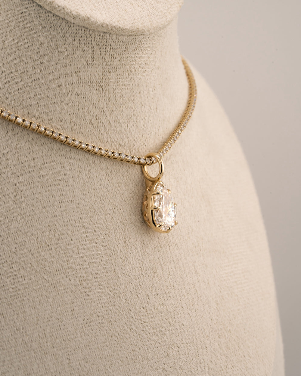 D'ORO Lab pear lab-grown diamond pendant on a gold tennis chain